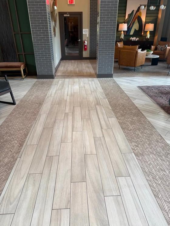 Polished tile lobby floor leading into a furnished lounge area
