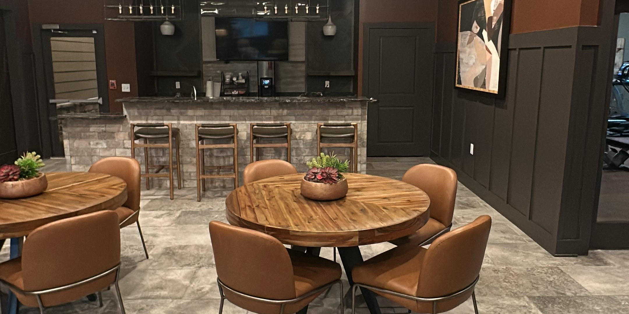 Spotless commercial lounge and bar area with polished stone floors